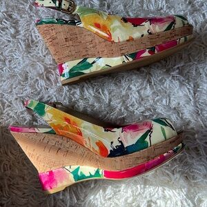 Floral high heeled sandal.
